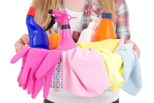 Insured carpet cleaners working carefully in a home setting